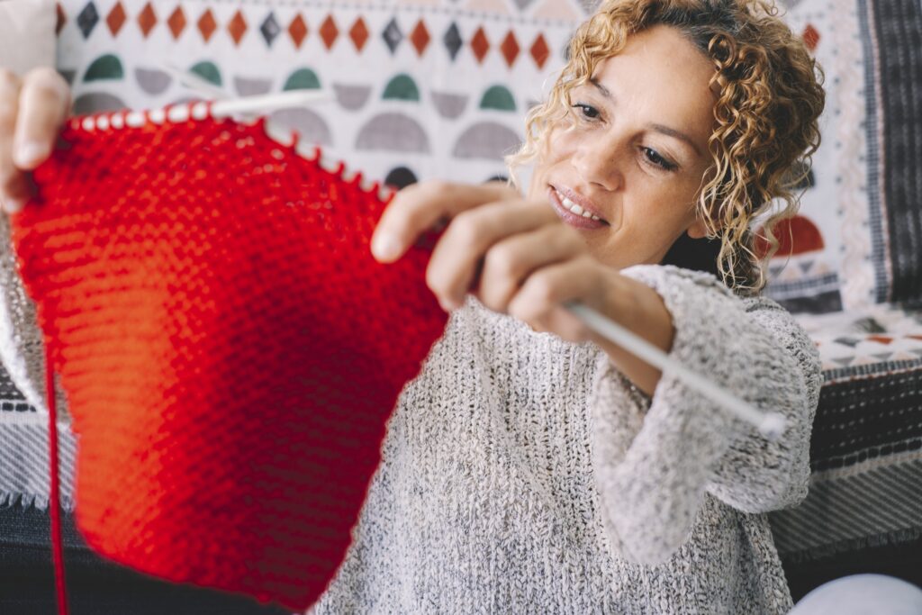 Adult woman at home in knitting